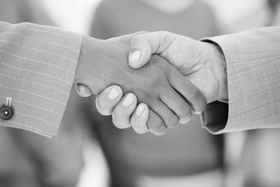 bigstockphoto_Business_People_Shaking_Hands__4035637